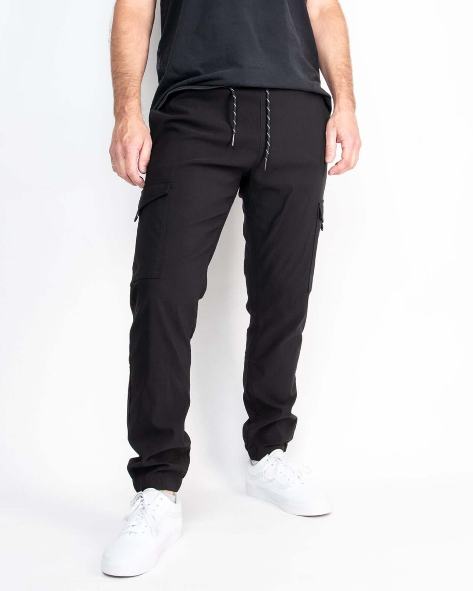 A pair of black performance tech cargo joggers with multiple pockets and a straight fit silhouette.