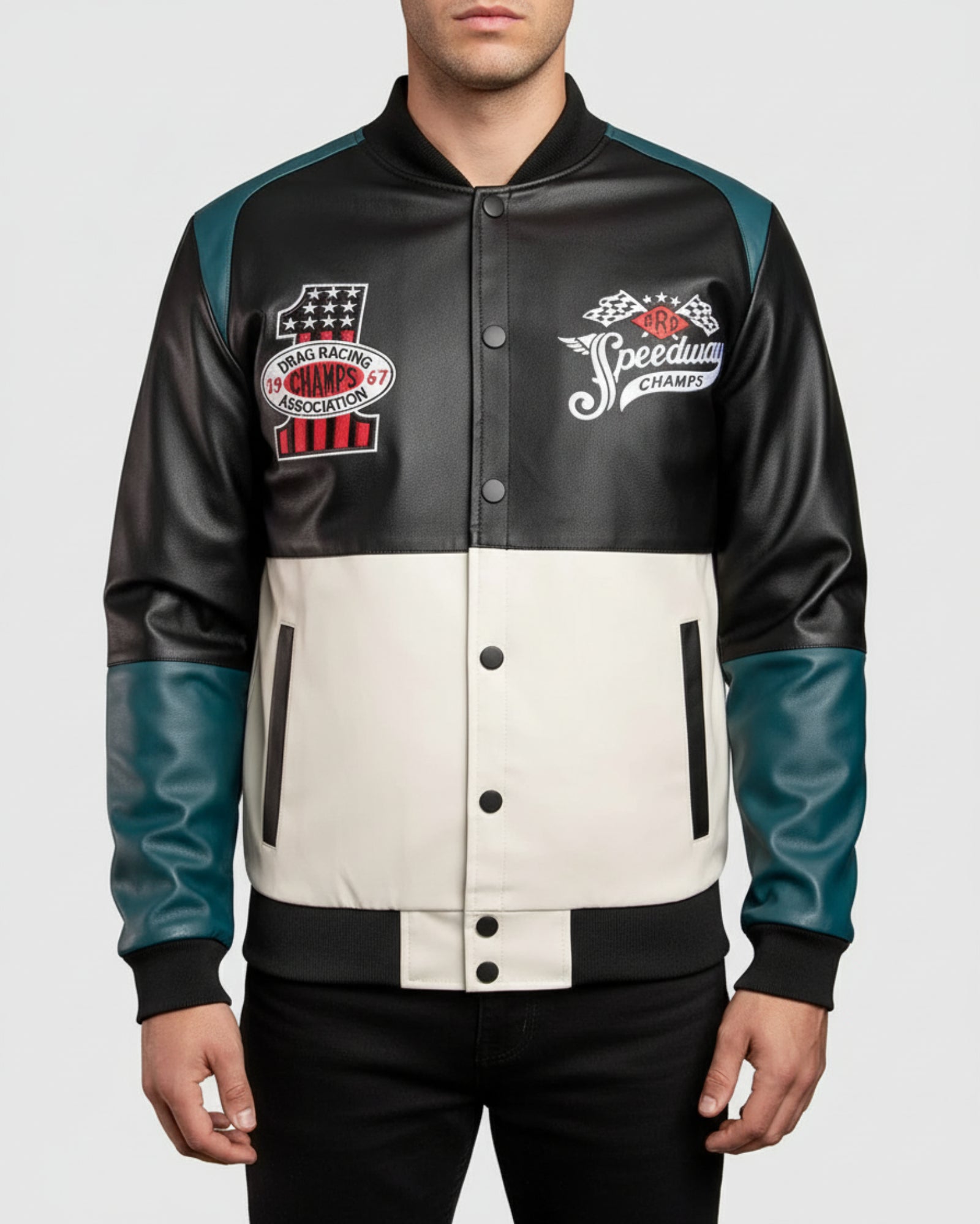 Black and white varsity jacket with racing-themed patches on a gray background