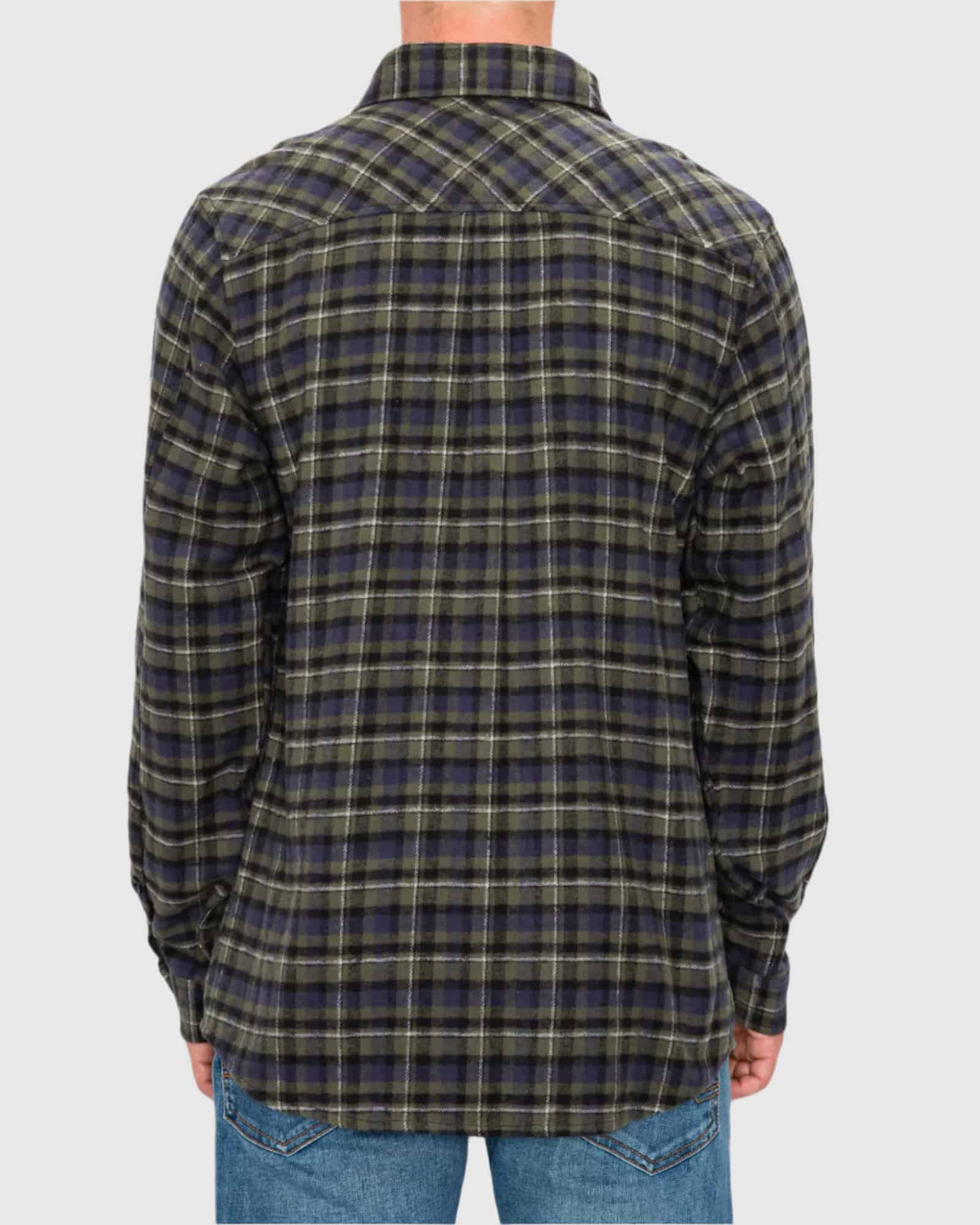 Person wearing a plaid shirt with a neutral background