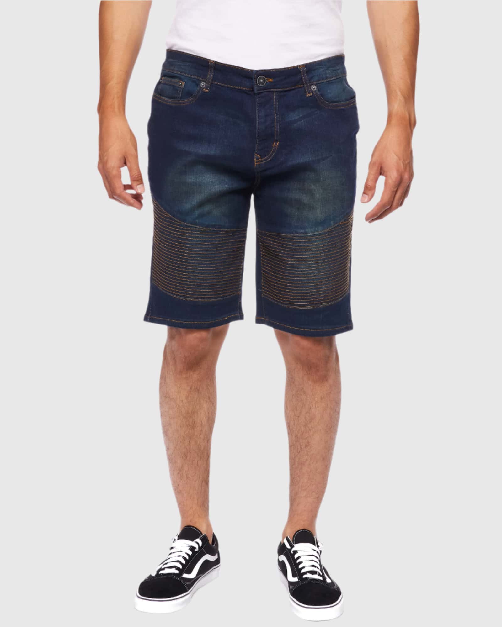 Front view of a model wearing the Men’s Brad Moto Denim Shorts in eclipse color, showing off the stylish design and relaxed fit