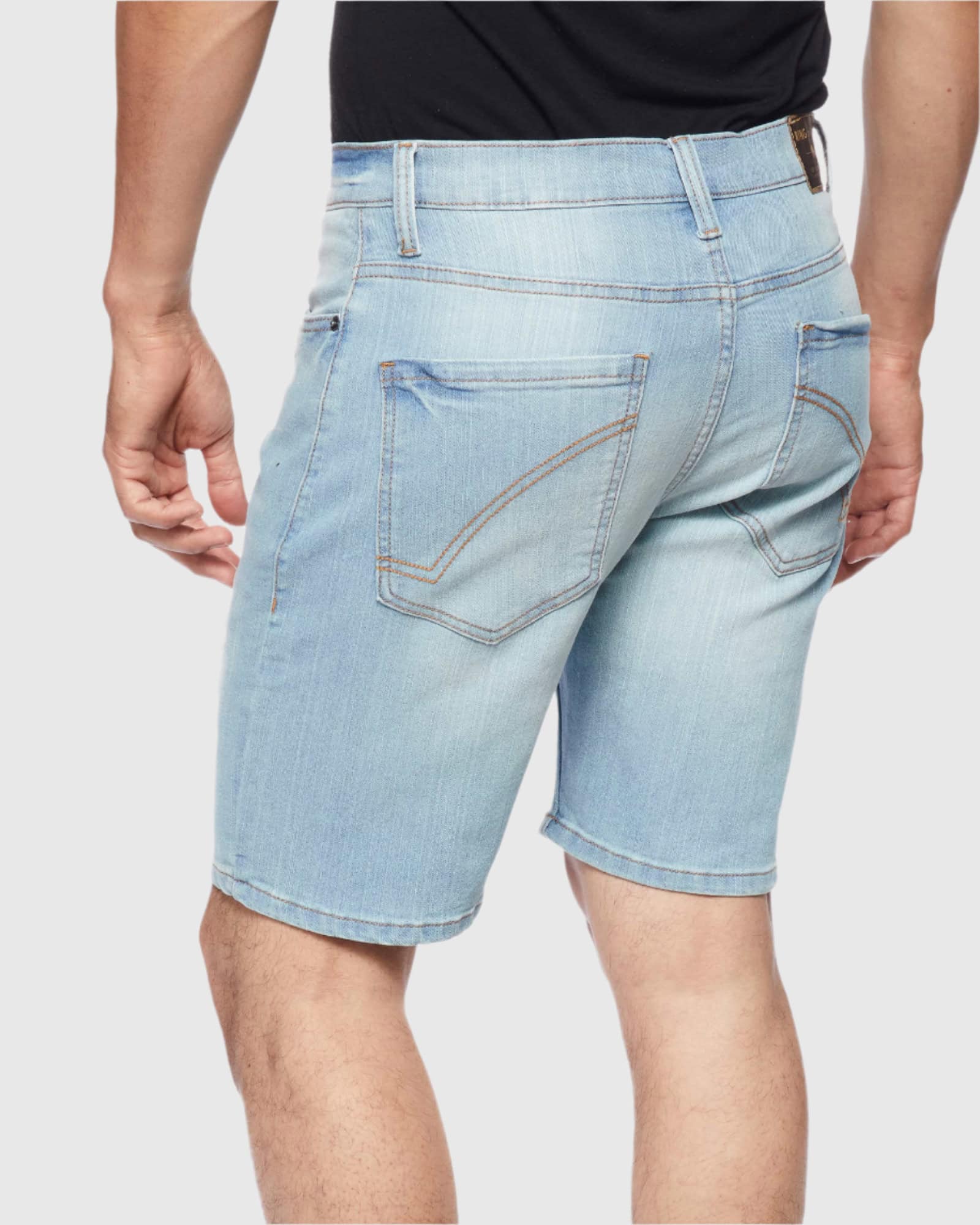 Back view of model in Smoke Blue Men’s Ripper Denim Shorts from Ring of Fire