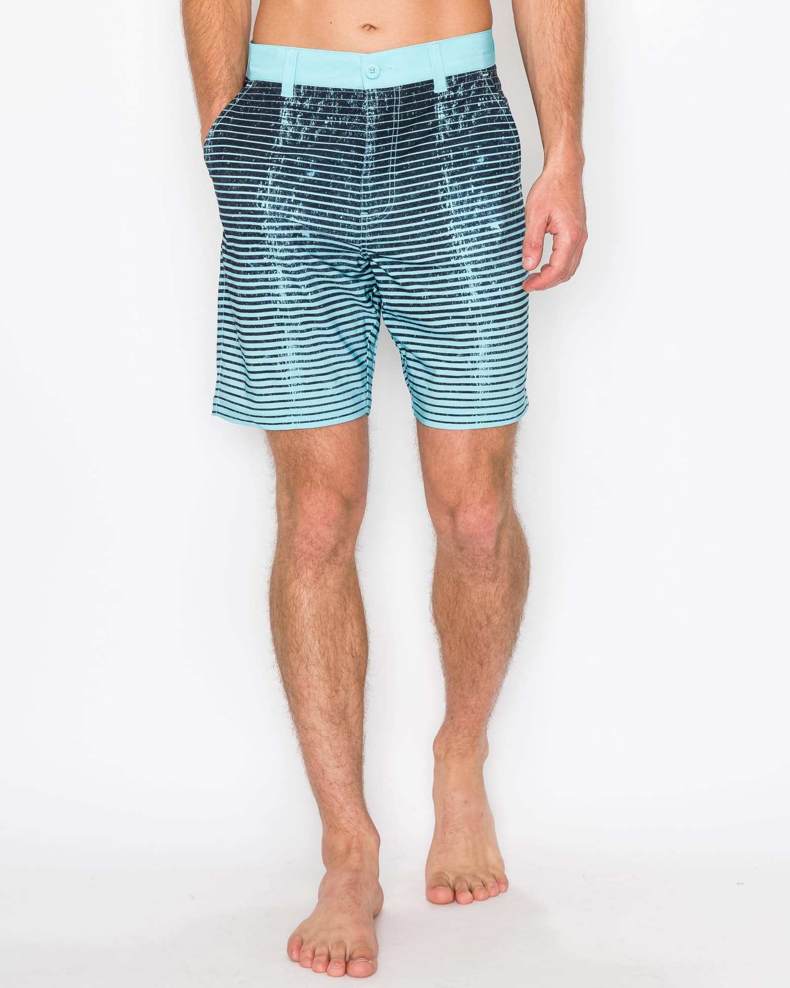 Man wearing blue striped swim shorts on a white background