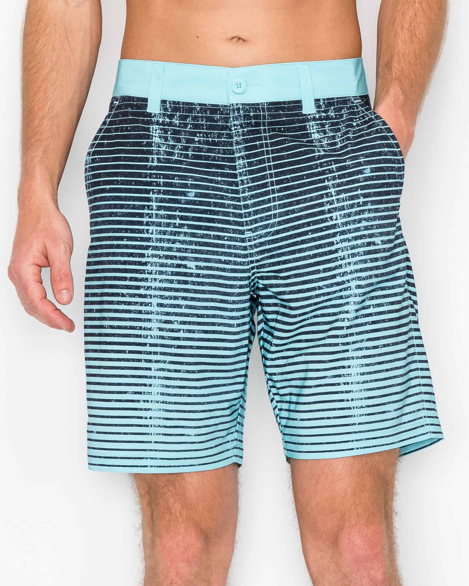 Blue striped shorts worn by a person on a white background