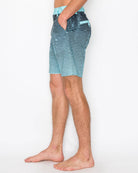 Person wearing blue striped shorts on a white background