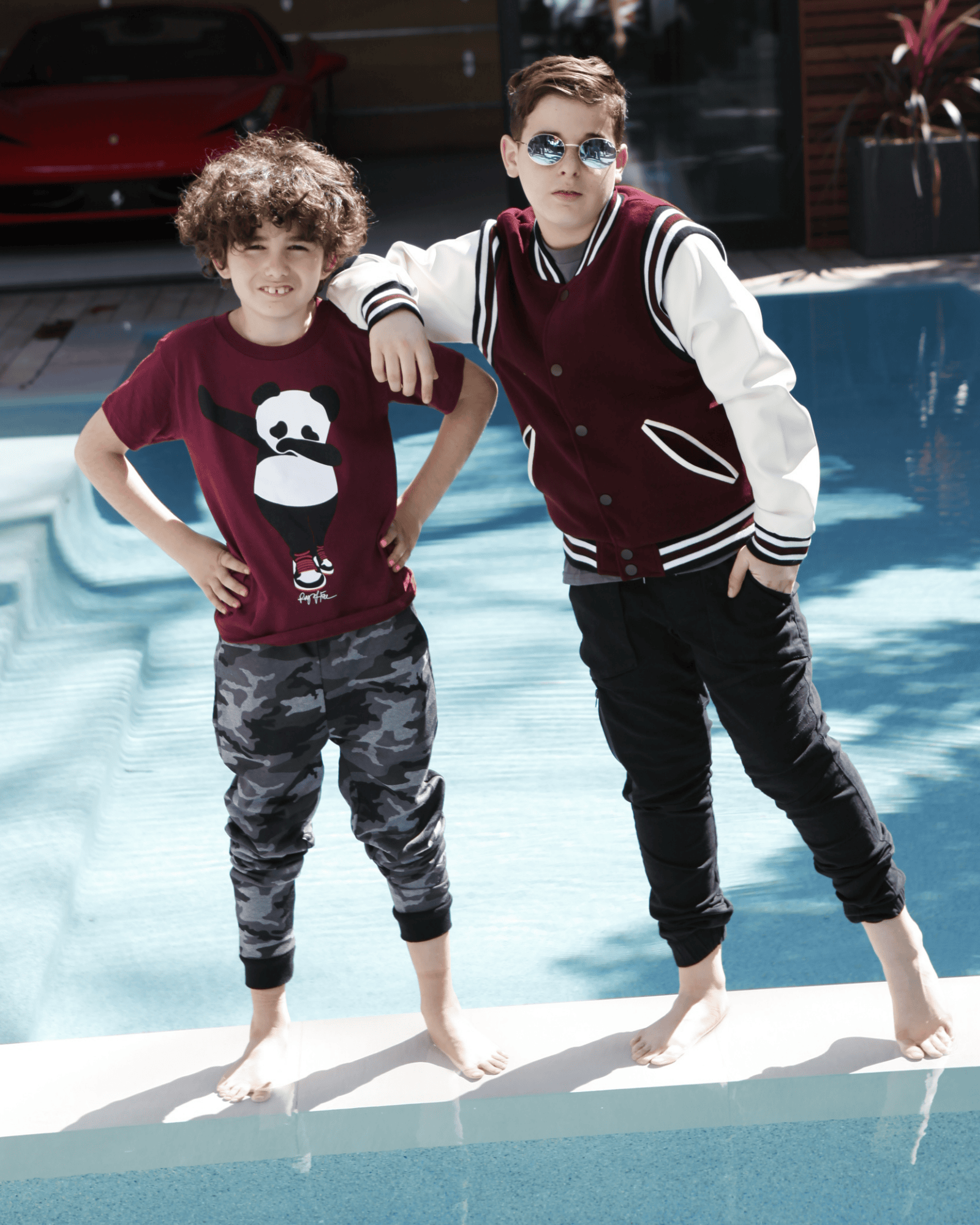 Two boys dressed in full outfits from our boys' collection, featuring jackets and joggers