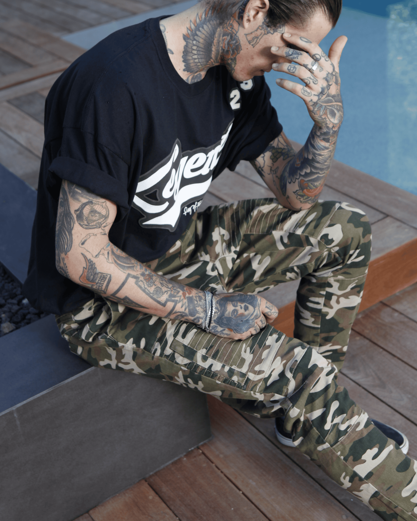 Model wearing green camouflage joggers from our latest collection