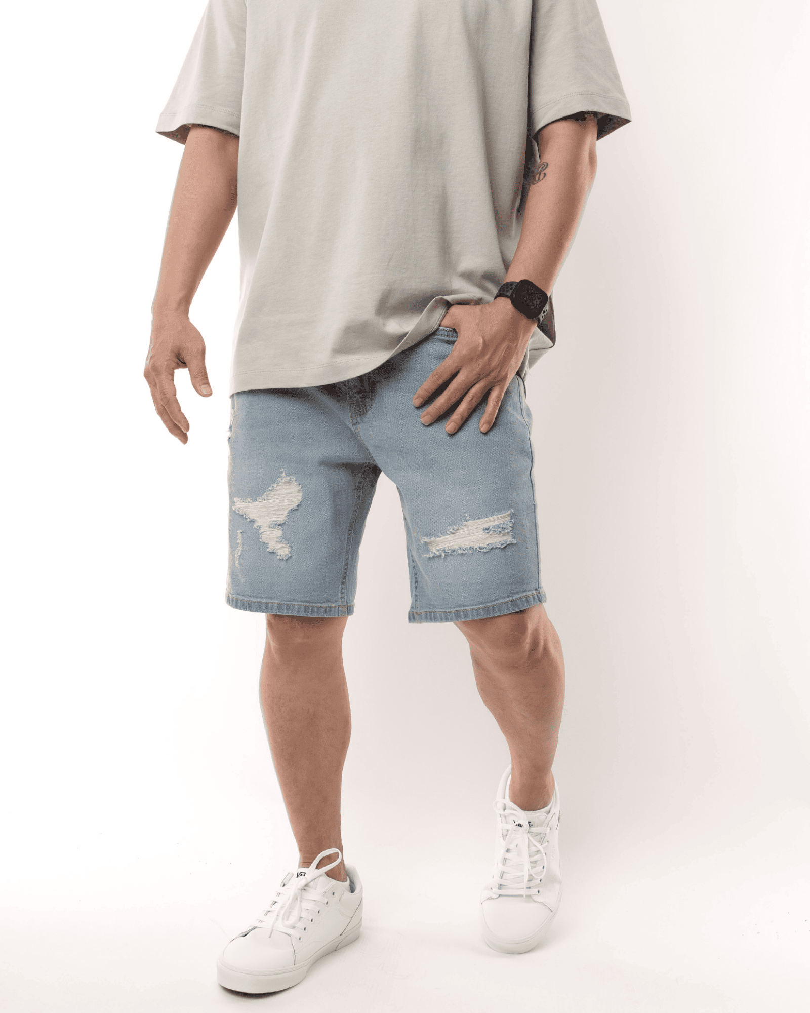 Bottom half view of a man sporting stylish shorts from our men's shorts collection
