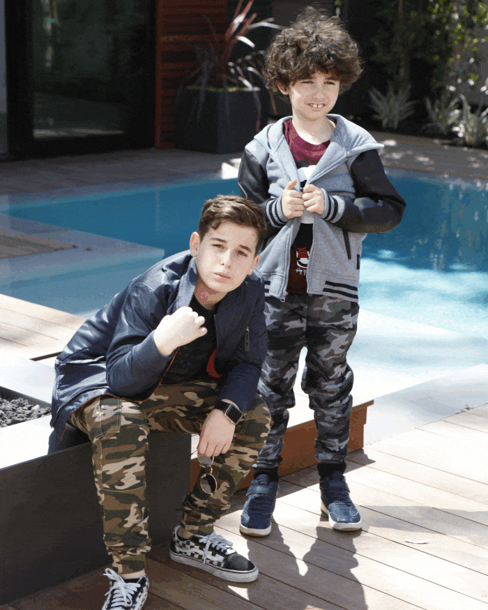 Rotating showcase of boy models wearing various outfits from our all-boys clothing collection