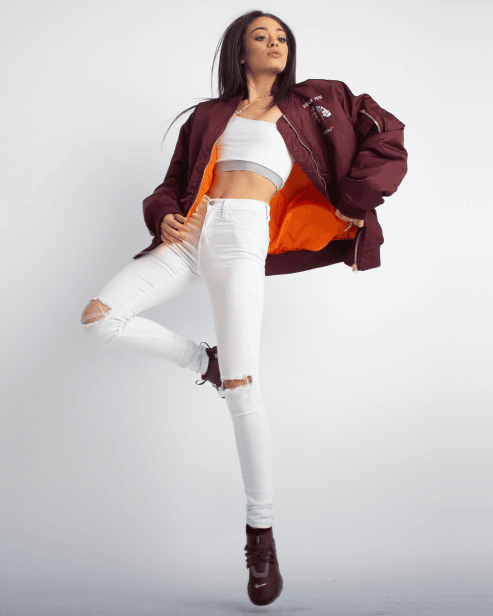 Woman posing in our signature denim jeans for the women's collection