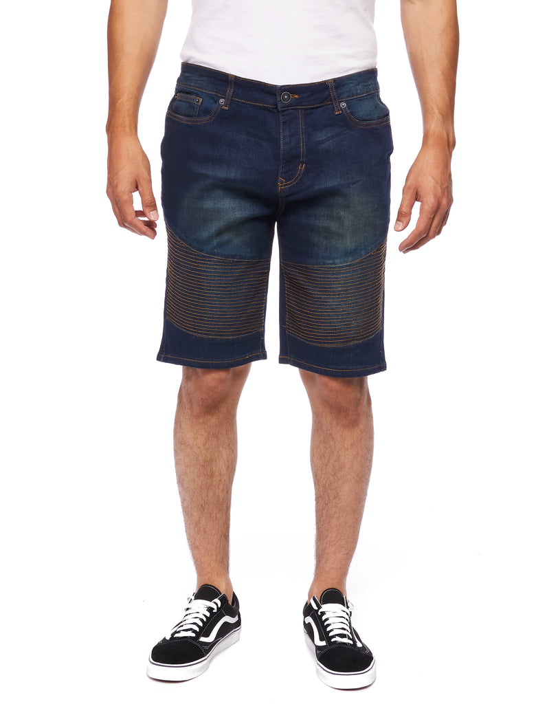 Front view of a model wearing the Men’s Brad Moto Denim Shorts in eclipse color, showing off the stylish design and relaxed fit