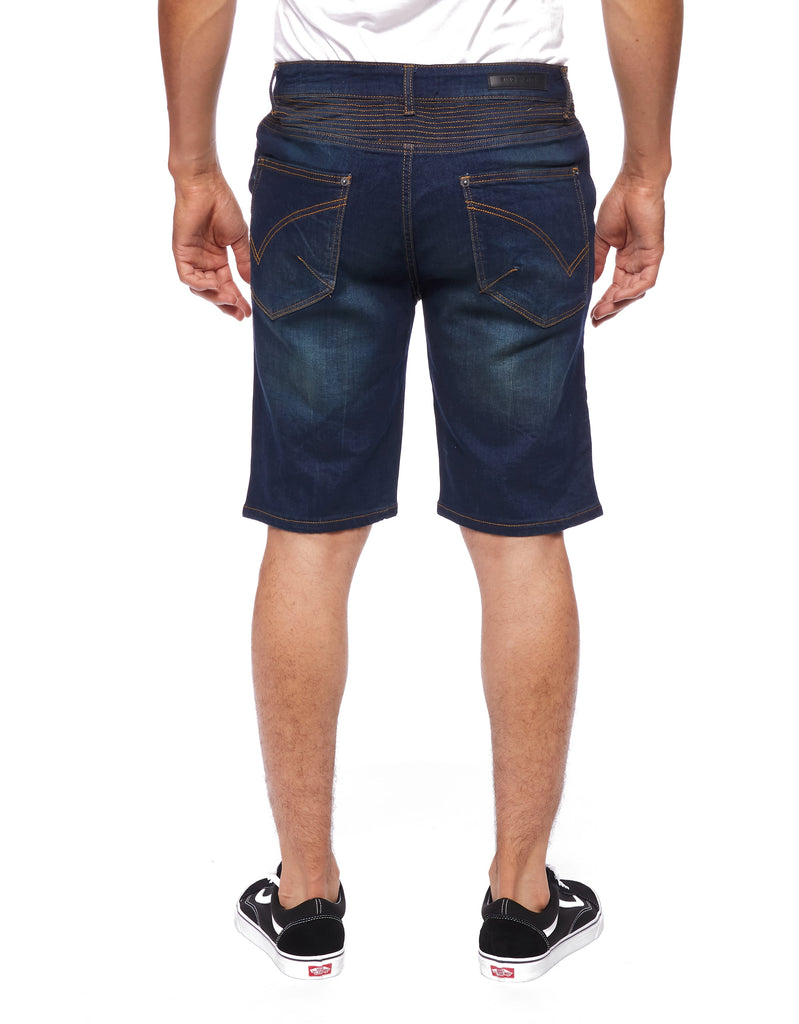Back view of a model wearing the Men’s Brad Moto Denim Shorts, featuring two back pockets and a clear view of the loose-straight fit