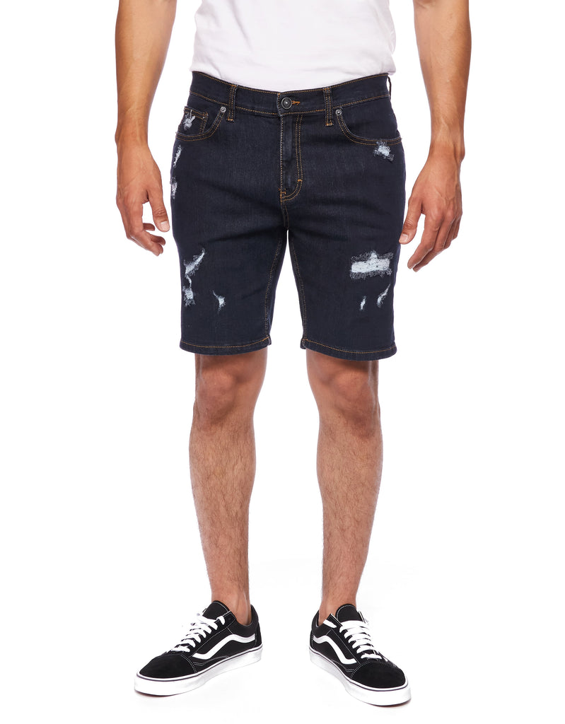 Front view of model showcasing Rinse Men’s Ripper Denim Shorts from Ring of Fire