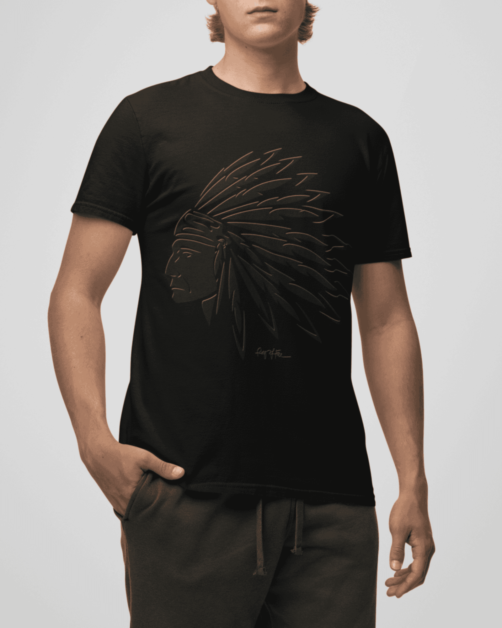 Person wearing a black t-shirt with a graphic design on a plain background