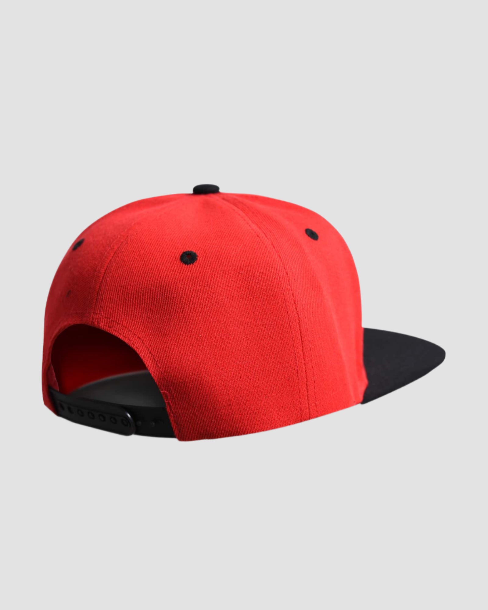 Back view of the one-size Men’s King Snapback in Red and Black colors, displaying the adjustable snapback feature.