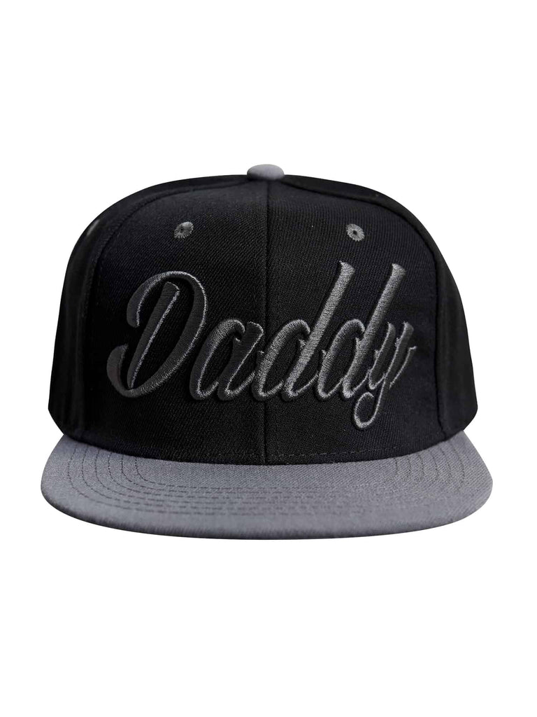 Front view of the ‘Men’s Daddy Snapback’ by Ring of Fire Clothing in Black Grey color, showcasing the stylish cursive ‘daddy’ text design, size one size.