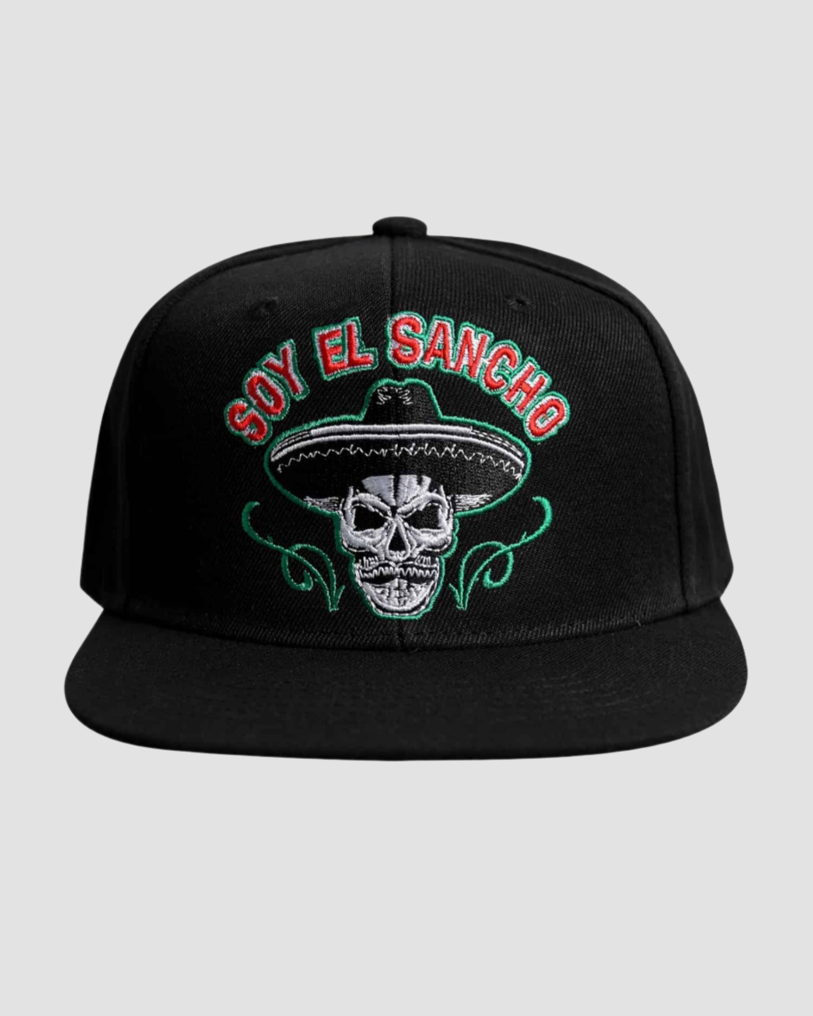 Front view of the ‘Men’s Soy El Sancho Snapback’ by Ring of Fire Clothing in Black Red White color, showcasing the unique skull with a sombrero design and the text ‘Soy El Sancho’, one size fits all.