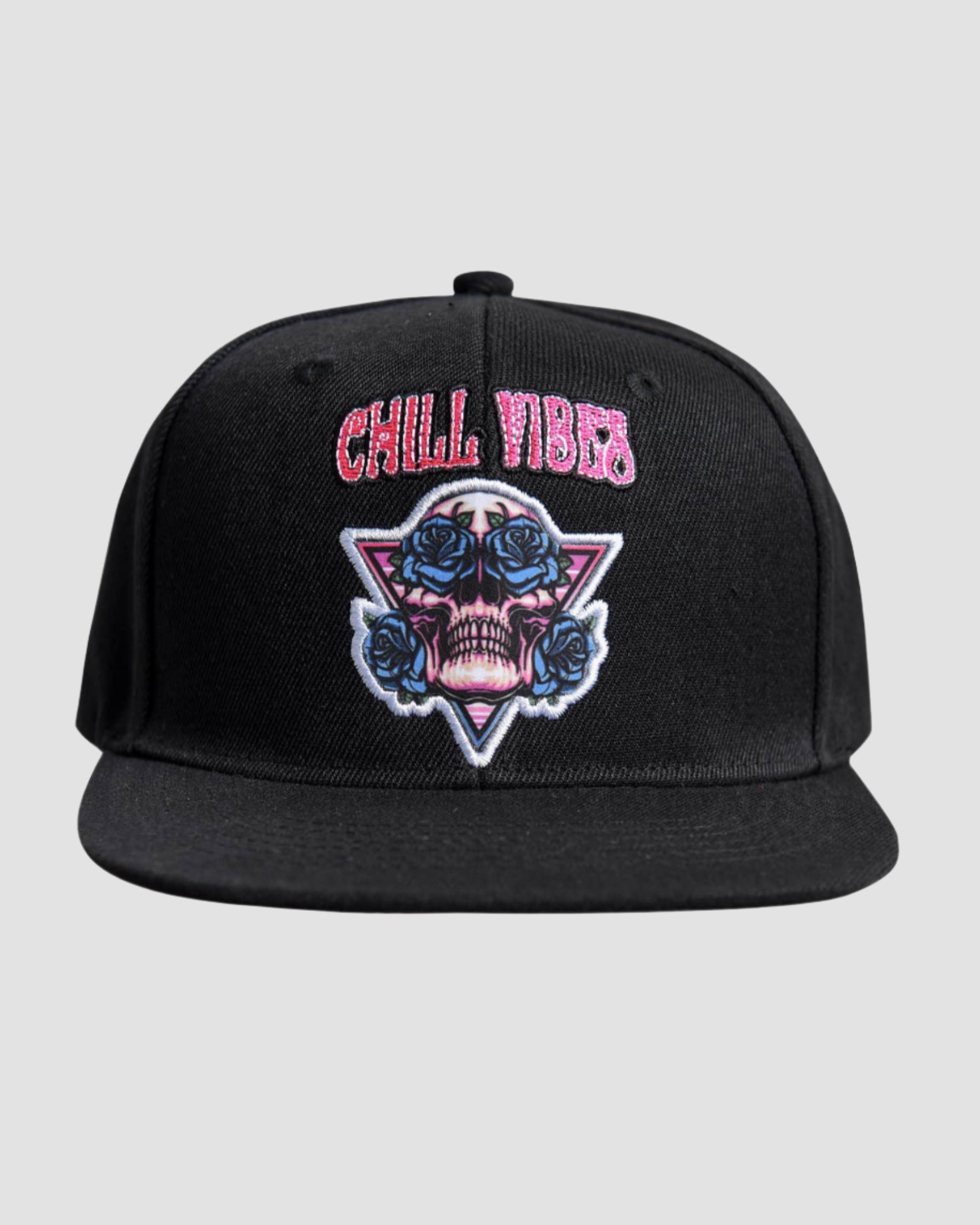 Front view of the Men’s Chill Skull Roses Snapback by Ring of Fire Clothing in Black, White, Red, and Blue colors, showcasing the unique skull design with roses in its eyes and ‘Chill Vibes’ text.