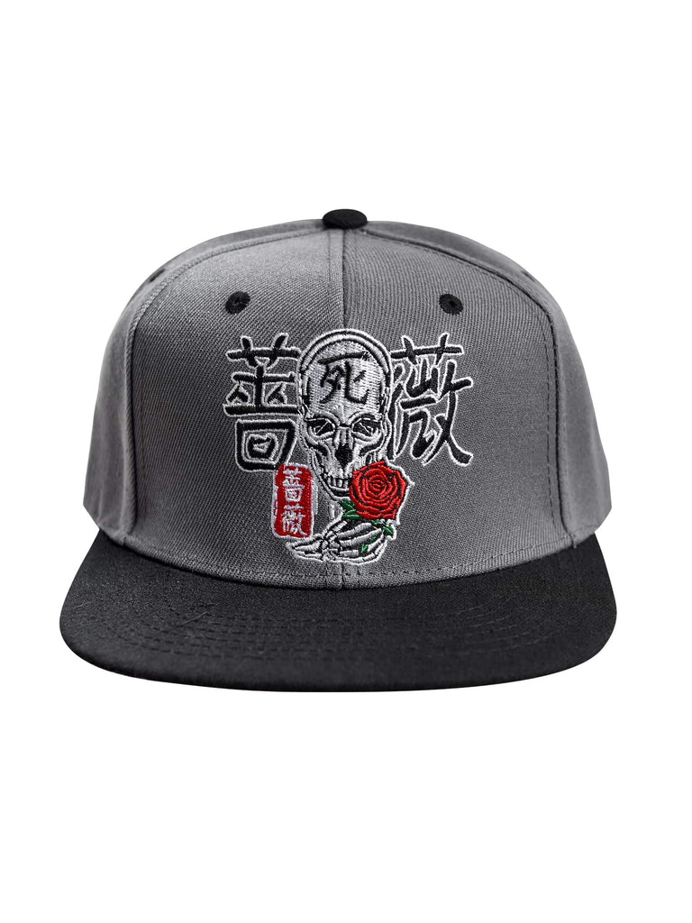 Front view of the Men’s Kanji Death Snapback by Ring of Fire Clothing in Black, Grey, White, and Red colors, showcasing the unique design of Japanese characters surrounding a skull with a rose.