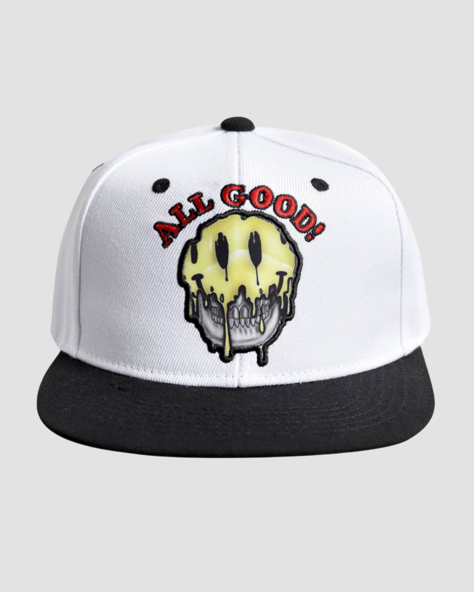 Front view of the Men’s All Good Snapback Cap in White Black color, showcasing the unique ‘all good’ text and melting smiley face design.