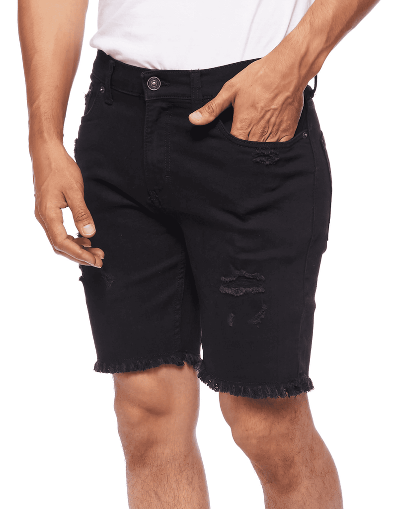 Side angle shot of a model wearing the Black Paradise Men’s Raw Edge Ripper Denim Shorts, highlighting the relaxed fit and style