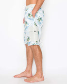 Side view of men’s palm geo cargo boardshorts highlighting the below-the-knee length and faux fly zipper.