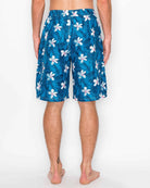 Back view of Men’s Midnight Bloom Cargo Boardshorts featuring the all-over tropical flower print and faux fly zipper.