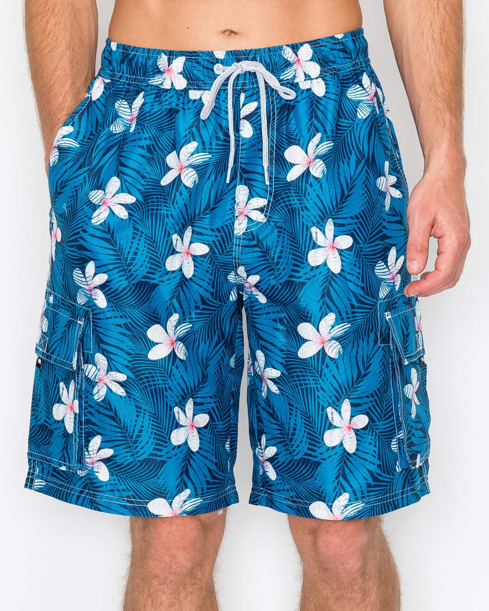 Close-up of Men’s Midnight Bloom Cargo Boardshorts showcasing the intricate tropical flower print on a midnight blue background.