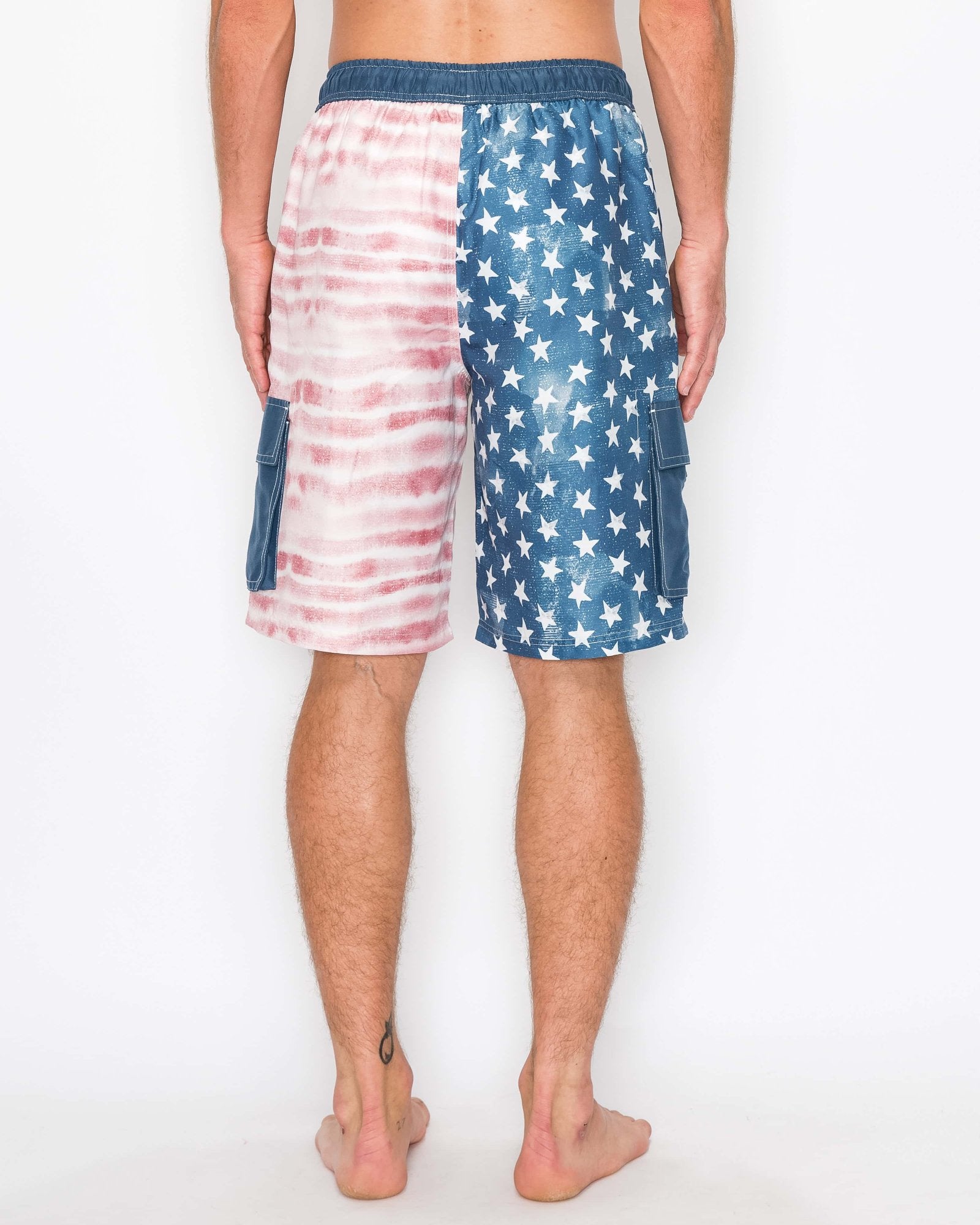 Back view of men’s Americana cargo boardshorts with an elastic waistband and American flag design.