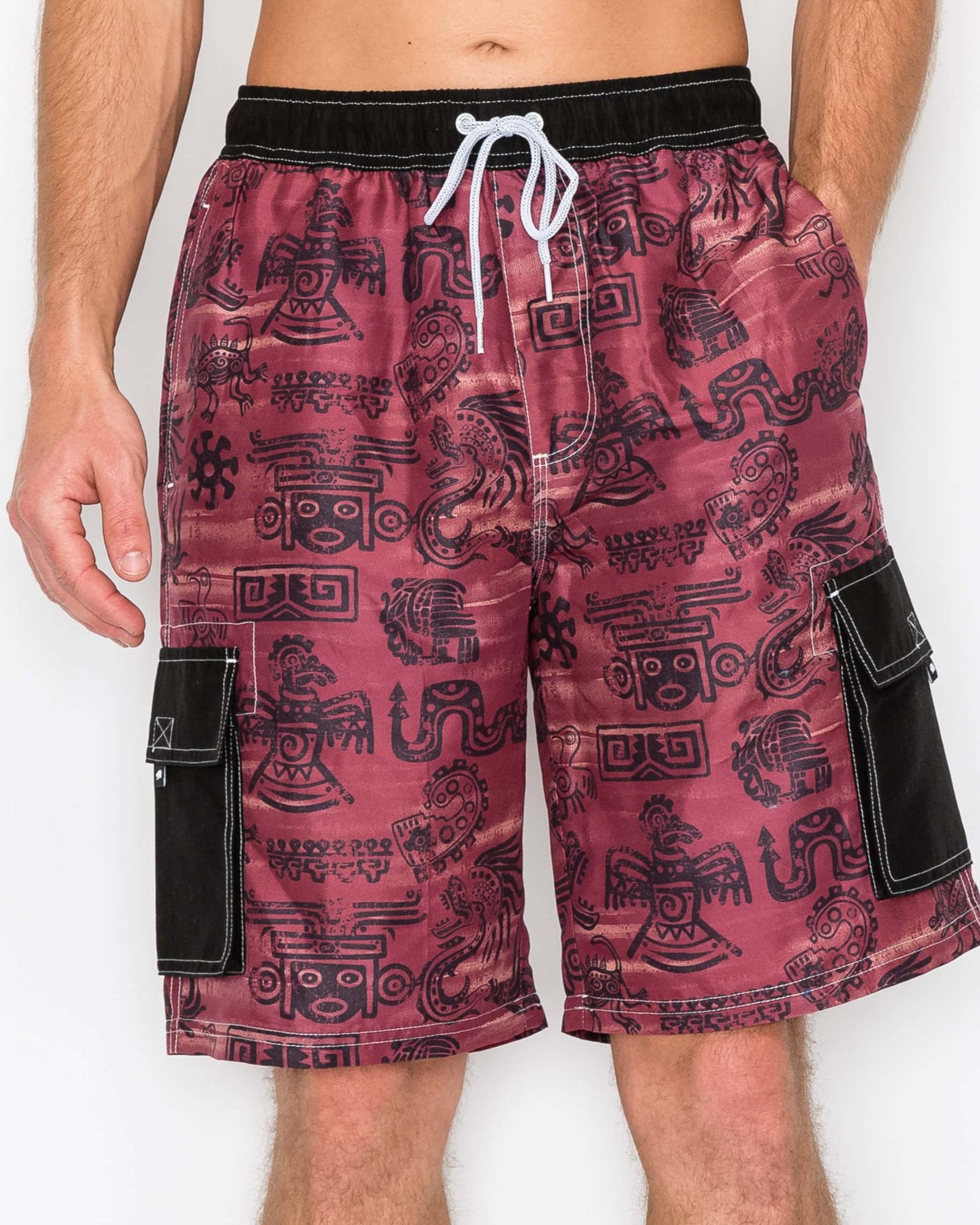 Close-up of Aztec Heat Cargo Boardshorts showcasing intricate Aztec tribal art on cargo pockets and breathable mesh interior netting.