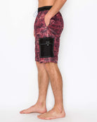 Side view of men’s Aztec Heat Cargo Boardshorts highlighting the Velcro cargo pocket with Aztec designs and side seam pocket.