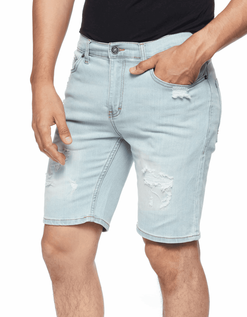 Front view of model wearing Ring of Fire’s Men’s Ripper Denim Shorts in Blue Bleached