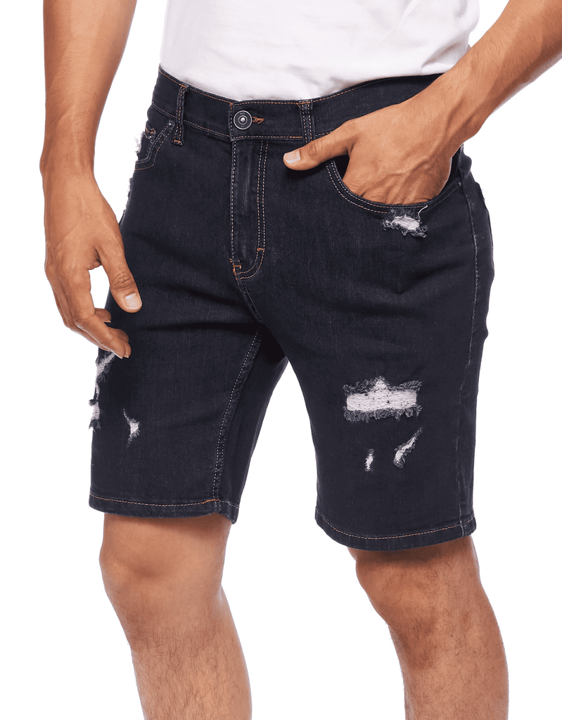 Angle view of model wearing Rinse color Men’s Ripper Denim Shorts by Ring of Fire