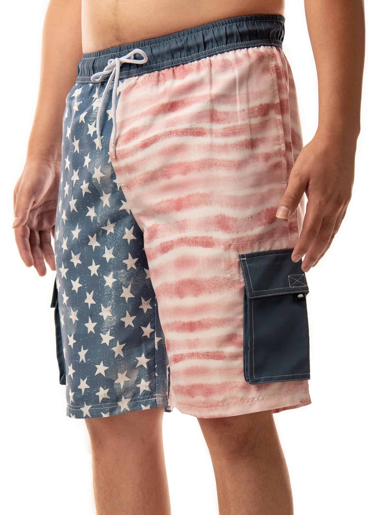 Side angle shot of the model wearing Men’s Americana Board Shorts, highlighting the patriotic design and comfortable fit
