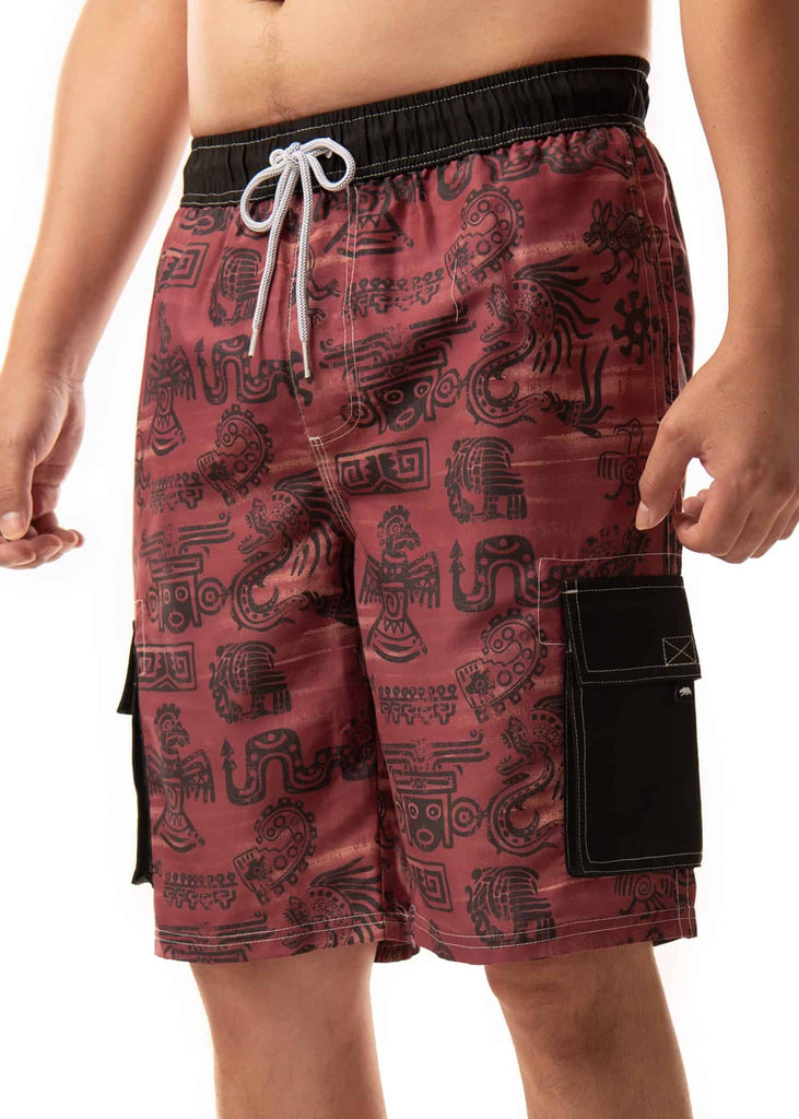 Angled view of model in Men’s Aztec Heat Board Shorts, accentuating the unique Aztec design on a merlot background