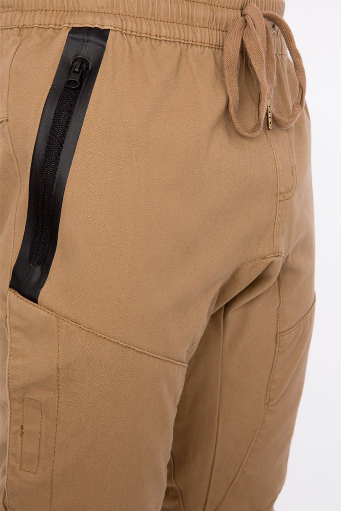 Mens drawstring major heat seal stretch joggers in Dull Gold side zip pocket 