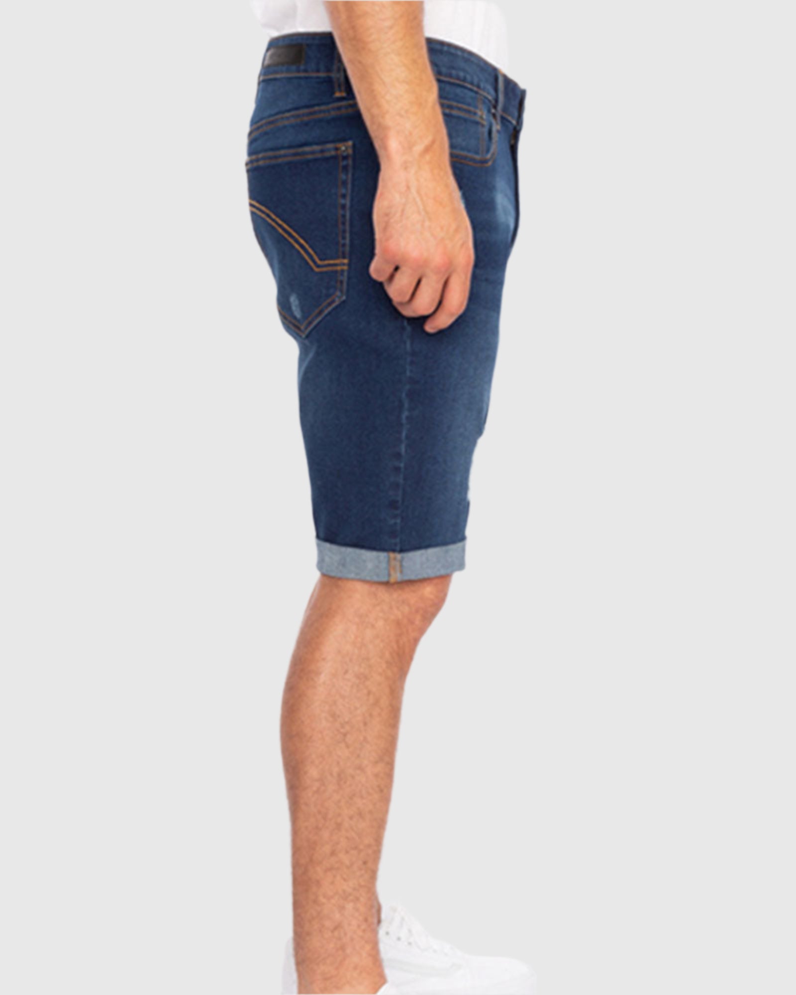Model wearing the Men’s Jake Rip N Repair Denim Shorts in Hunter color, side angle view
