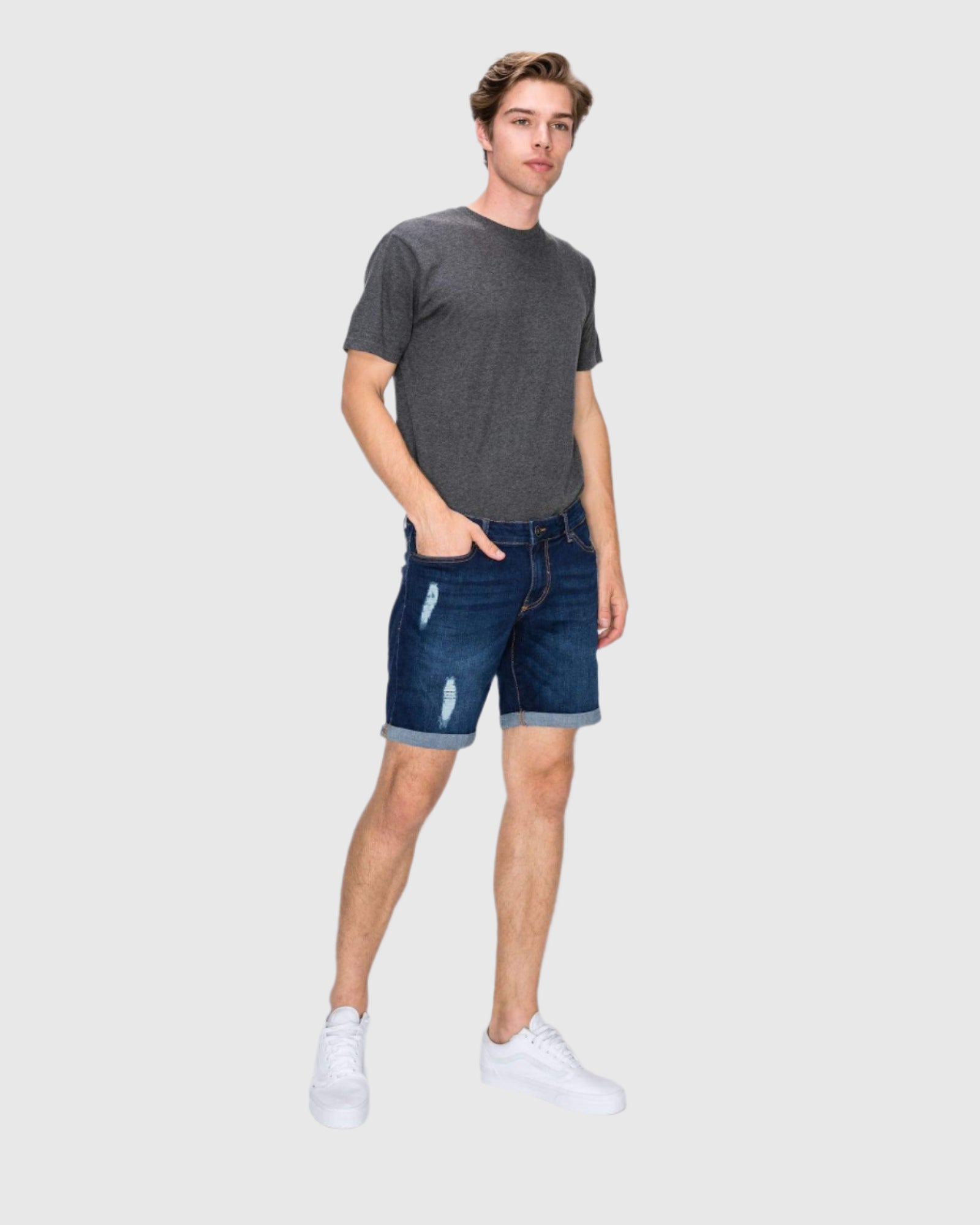 Side angle view of the Men’s Jake Rip N Repair Denim Shorts in Twilight color on model