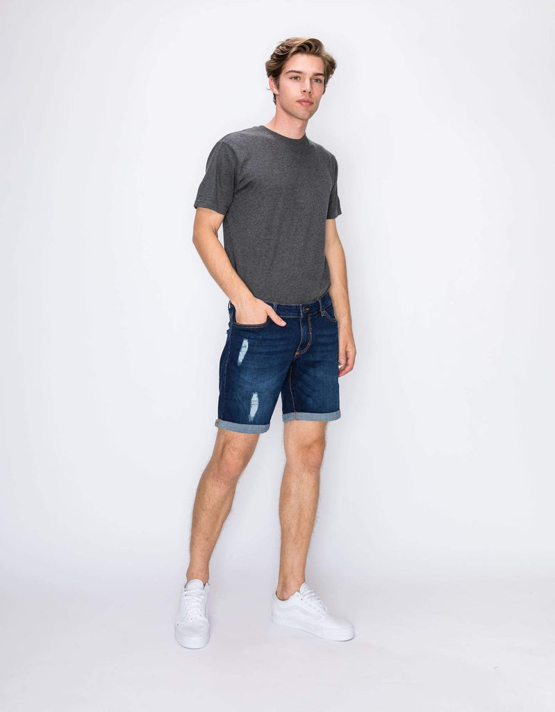 Side angle view of the Men’s Jake Rip N Repair Denim Shorts in Twilight color on model