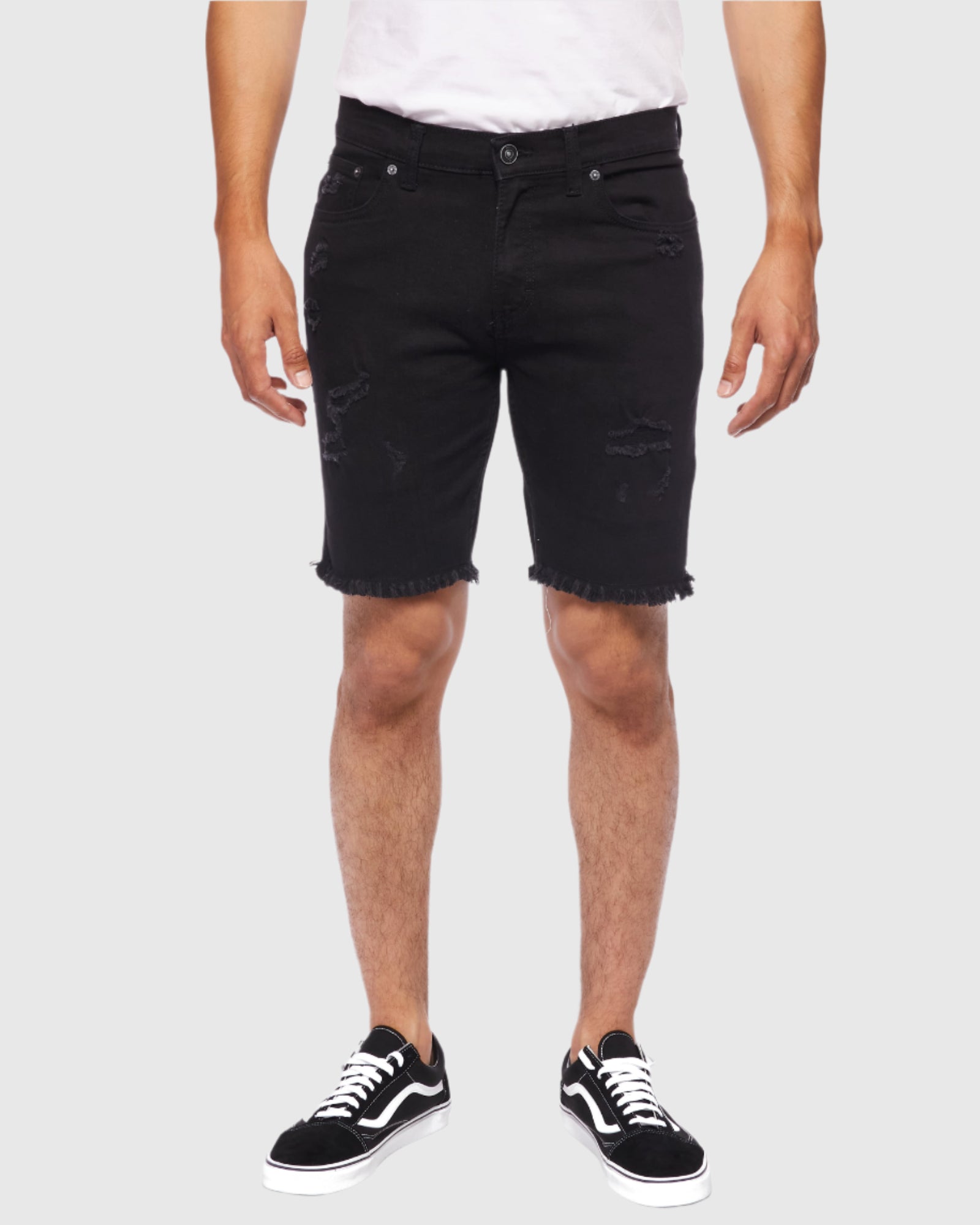 Model showcasing the front view of the Black Paradise Men’s Raw Edge Ripper Denim Shorts from Ring of Fire Clothing