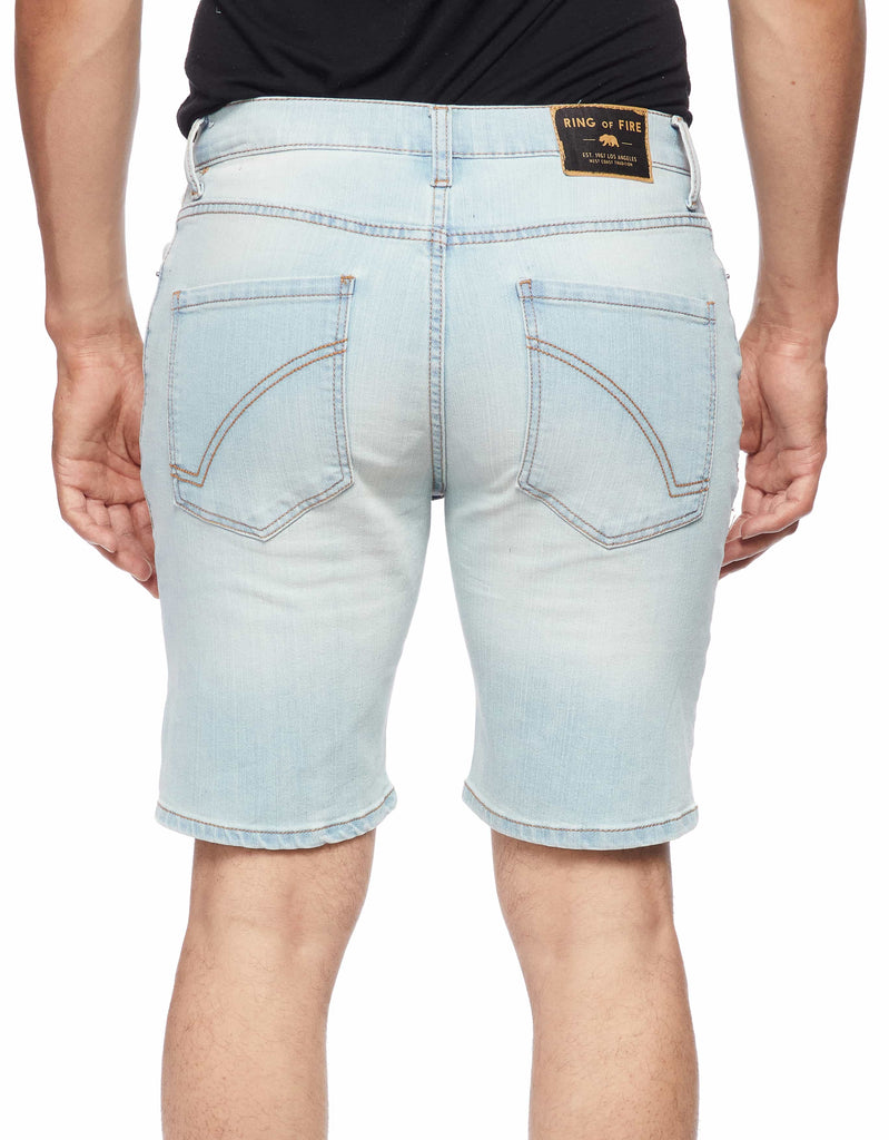 Model showing back view of Blue Bleached Men’s Ripper Denim Shorts by Ring of Fire