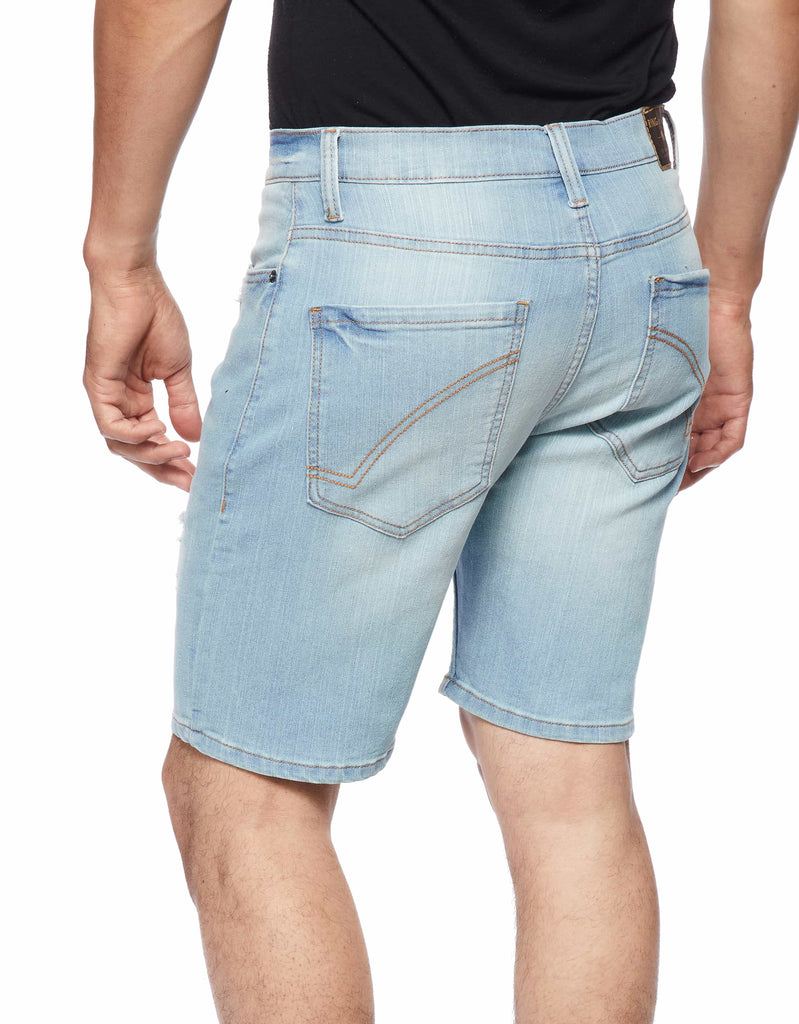 Back view of model in Smoke Blue Men’s Ripper Denim Shorts from Ring of Fire